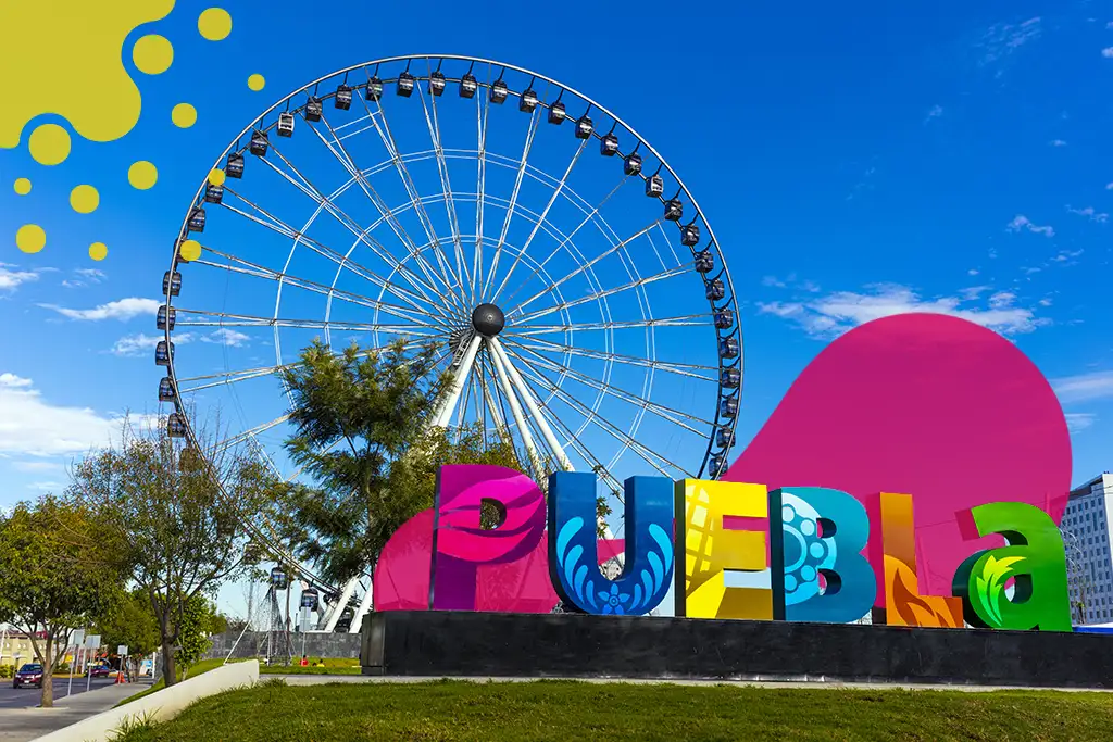 rueda de la fortuna frente a letrero puebla | JAPI